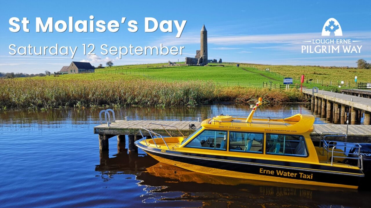 Image showing yellow boat moored at the jetty with the monastic buildings of Devenish Island in the background